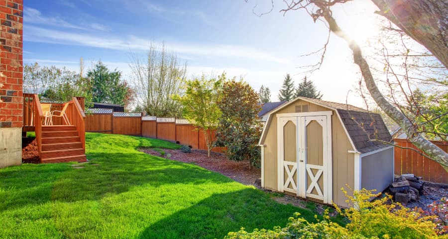 Fenced backyard with storage shed in South Bend